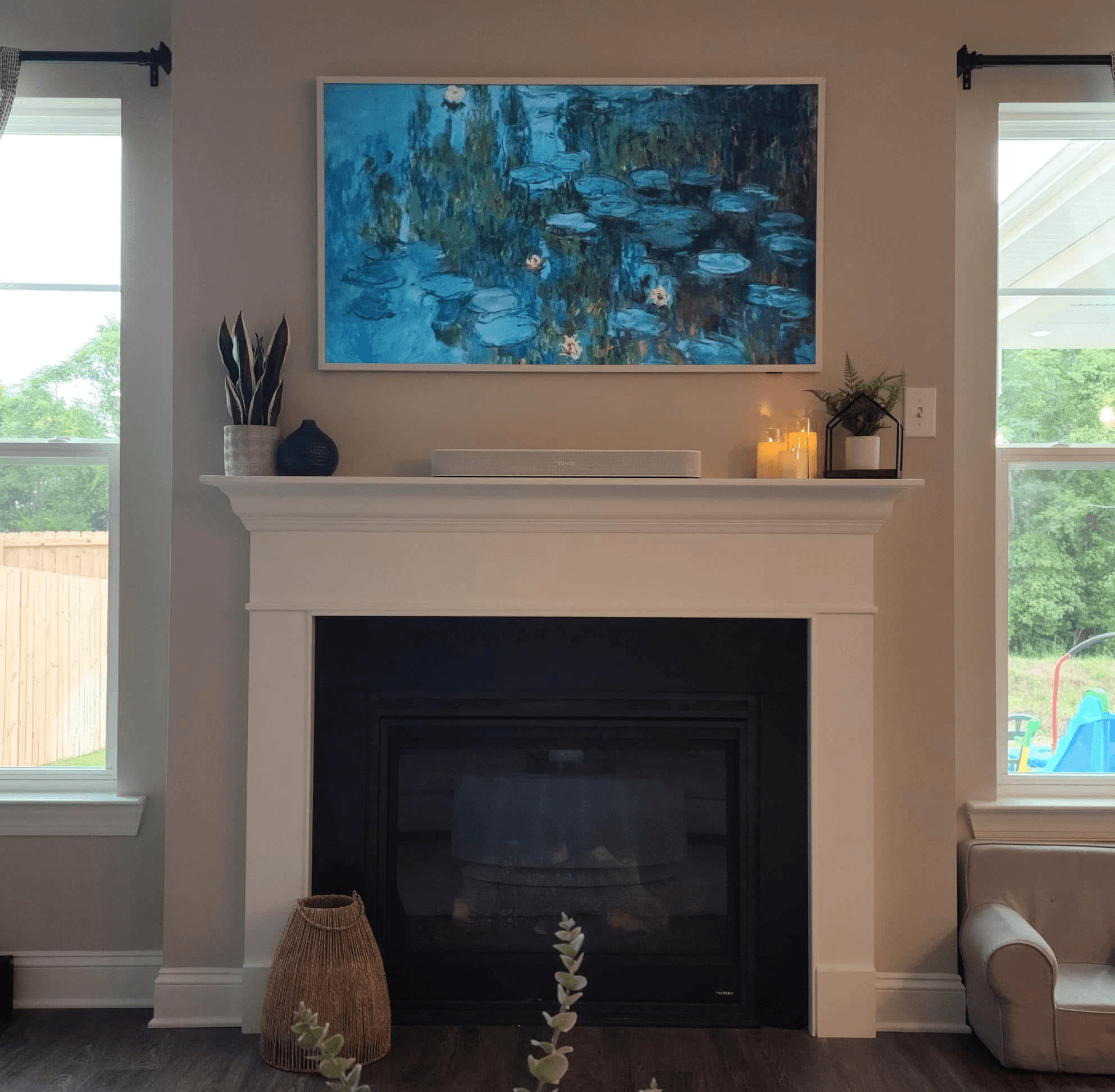 Samsung Frame TV with ornate frame above traditional fireplace - installed by Hide Ur Wires