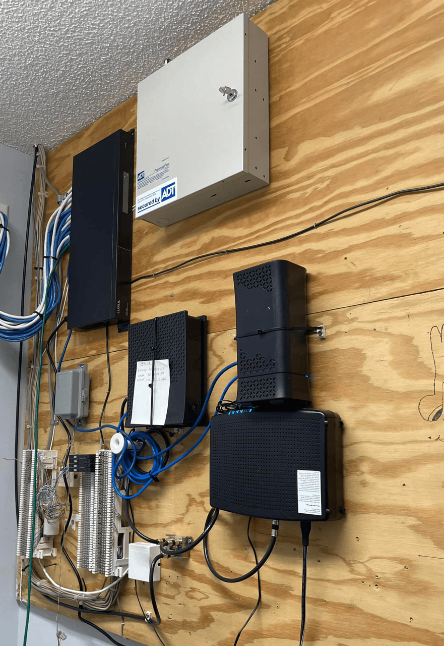 Utility wall with network equipment and ADT panel